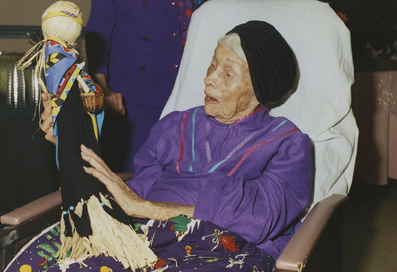 Te Ata is given a doll on her 99th birthday celebration